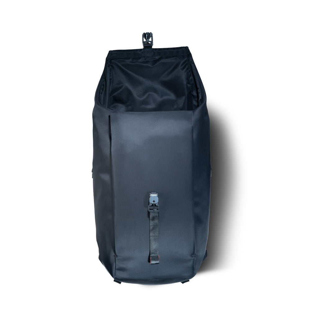 Top-down view into the open main compartment of the black daypack.