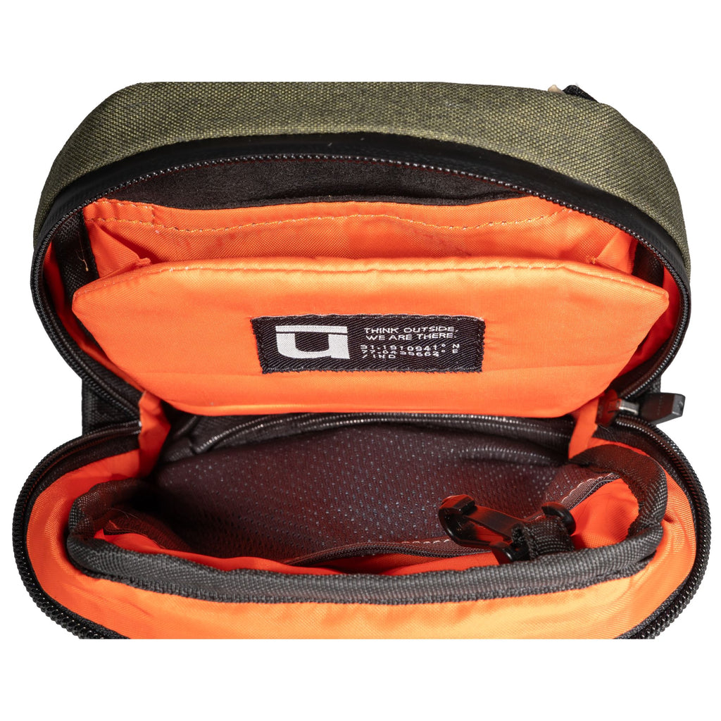 Open top view of the microsling revealing the bright orange inner pockets.