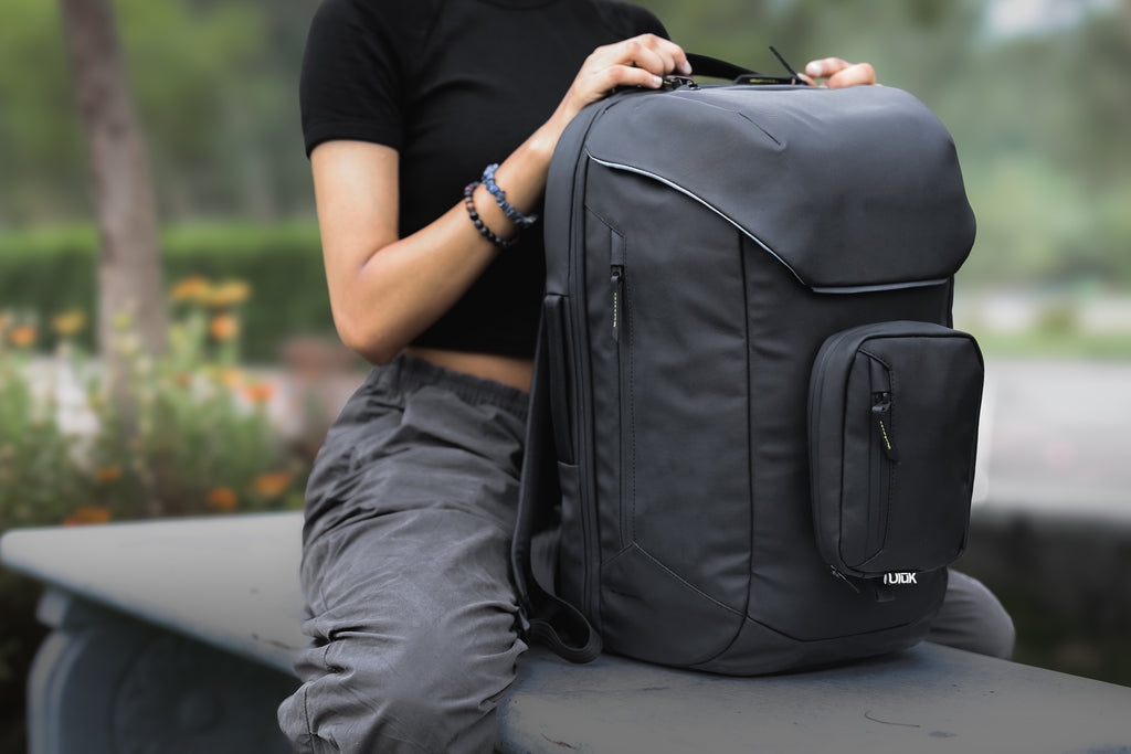 User holding EDC .28 TPU Onyx Black Backpack by Uluk Outdoors 