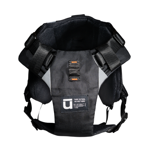 Front chest panel view of the black Ulūk Outdoors dog harness against a white background. 