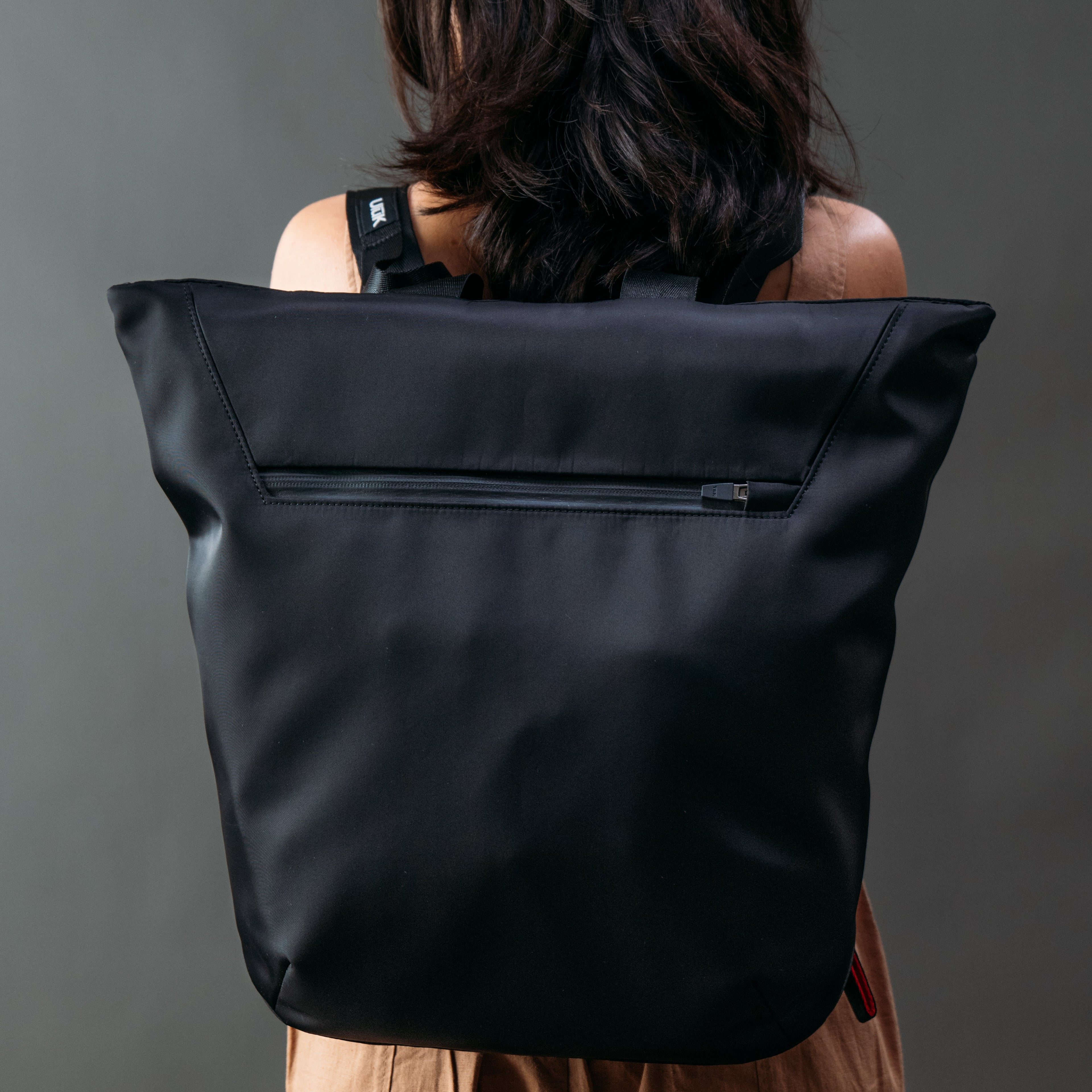 ULŪK EDC.15 Totepack rear view highlighting clean construction, premium materials, and urban travel design